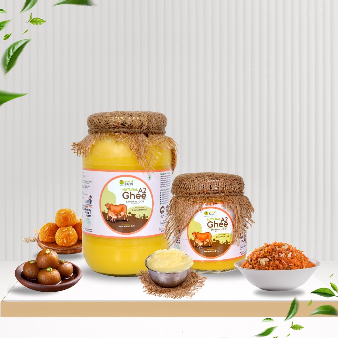 Nutriearth A2 Cow Ghee Sahiwal in glass jars with jute lids, displayed with Indian sweets and food. Buy A2 Desi Ghee online for purity and taste.