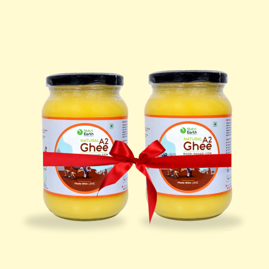 Nutriearth A2 Cow Ghee Badri in glass jars with jute covers, bundled with a red ribbon. Premium dairy product from (Himalayan Cow) cow milk.