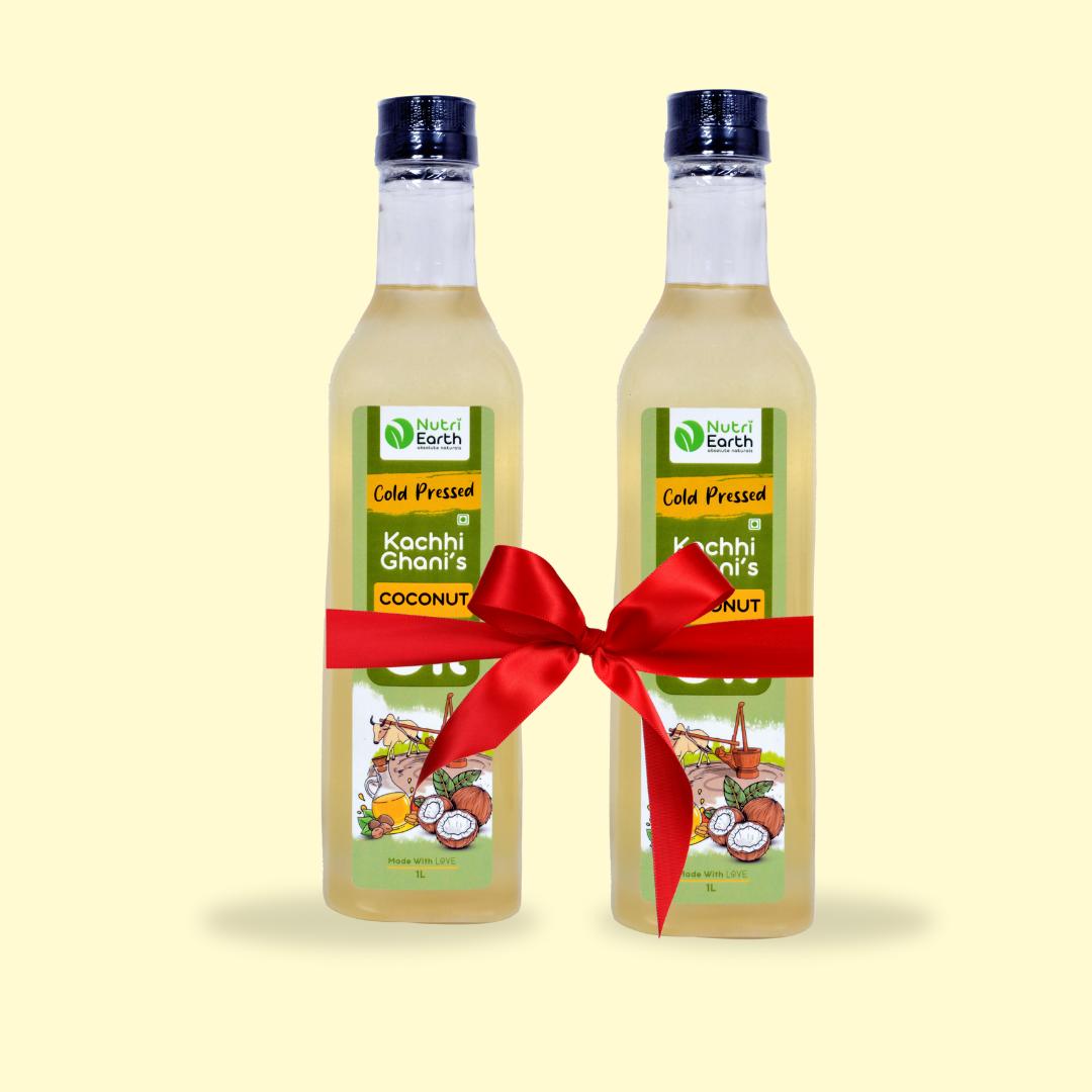 Nutriearth Wooden Cold Pressed Coconut Oil
in bottle with black lid, bundled with a red ribbon. Premium wood cold pressed oil buy online.