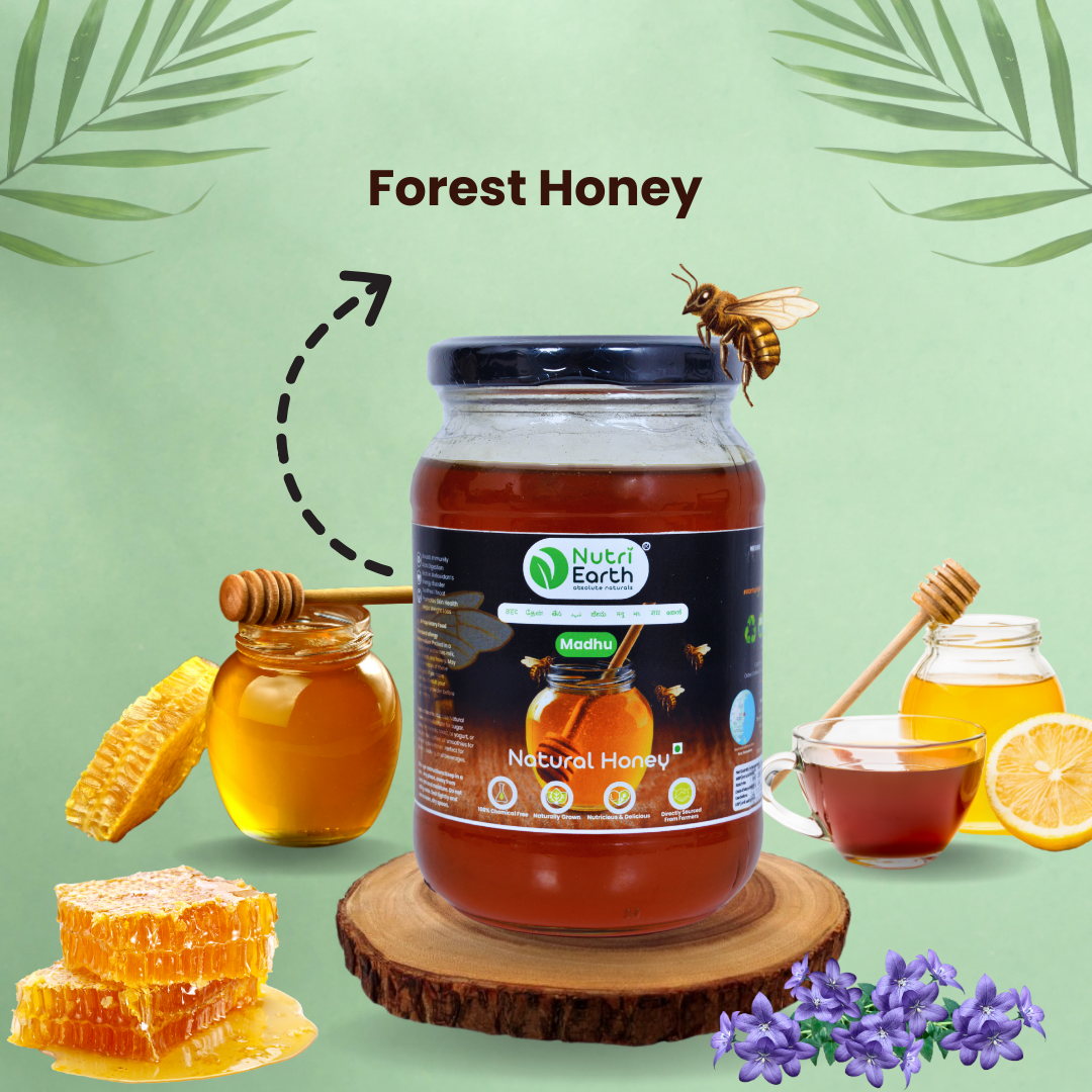 Nutriearth Natural Forest Honey in a glass jar with black lid, displayed with honey comb, wild flowers. Buy Natural Forest Honey online