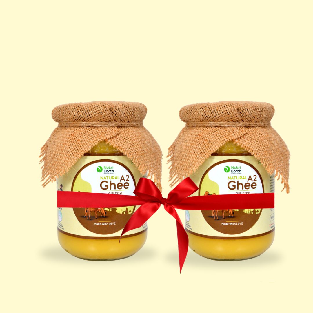 Nutriearth A2 Cow Ghee Gir  in glass jars with jute covers, bundled with a red ribbon. Premium dairy product from Gir cow milk.