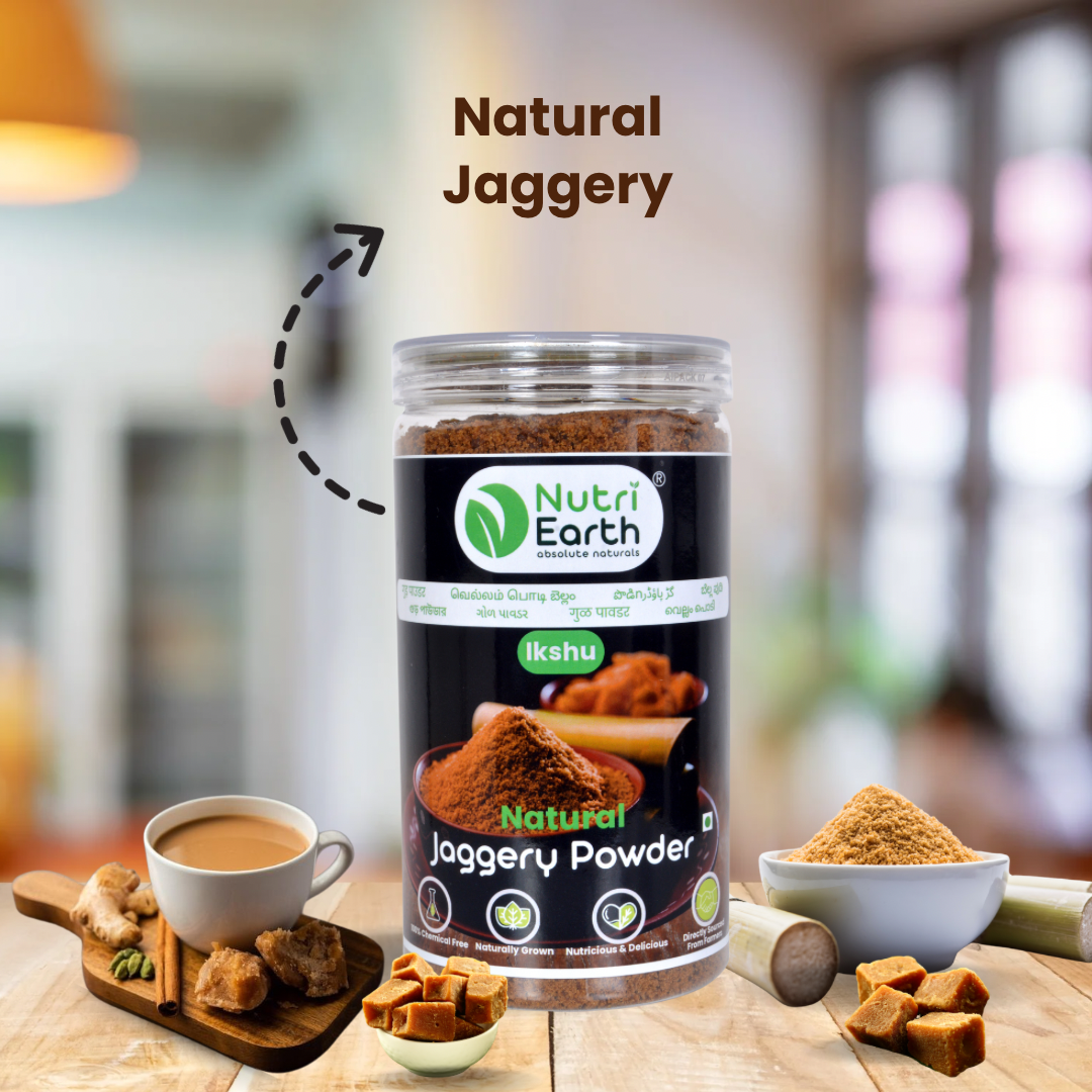 Nutriearth Natural Jaggery Powder
in a plastic bottle with transparent Lid, displayed with jaggery tea and jaggery lumps. Buy Natural Jaggery Powder online.
